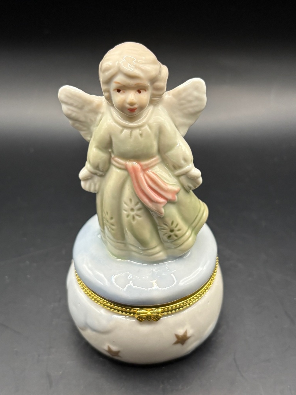 Little Girl Angel Standing on a Trinket Box